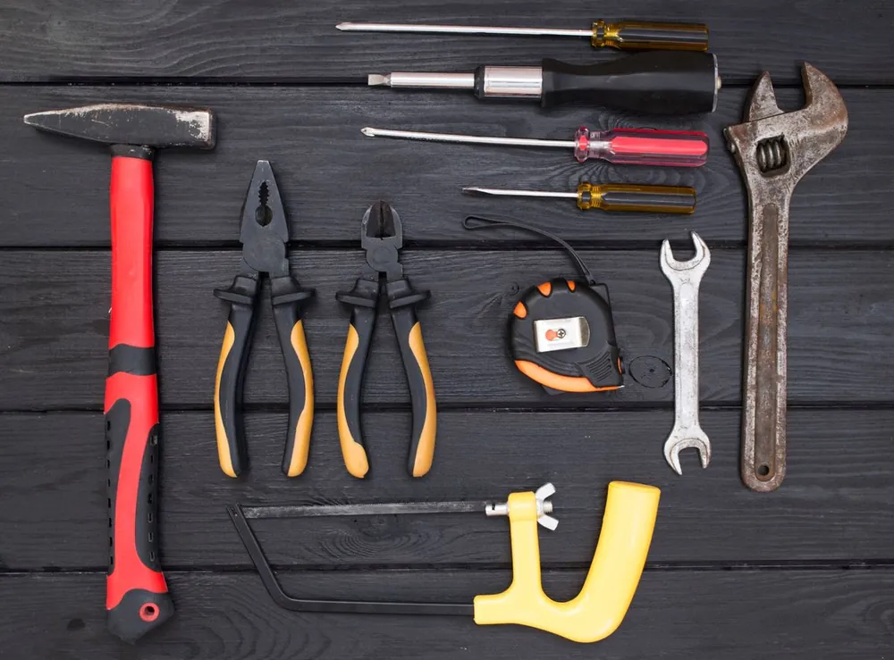 Hand tools laid out on a workbench