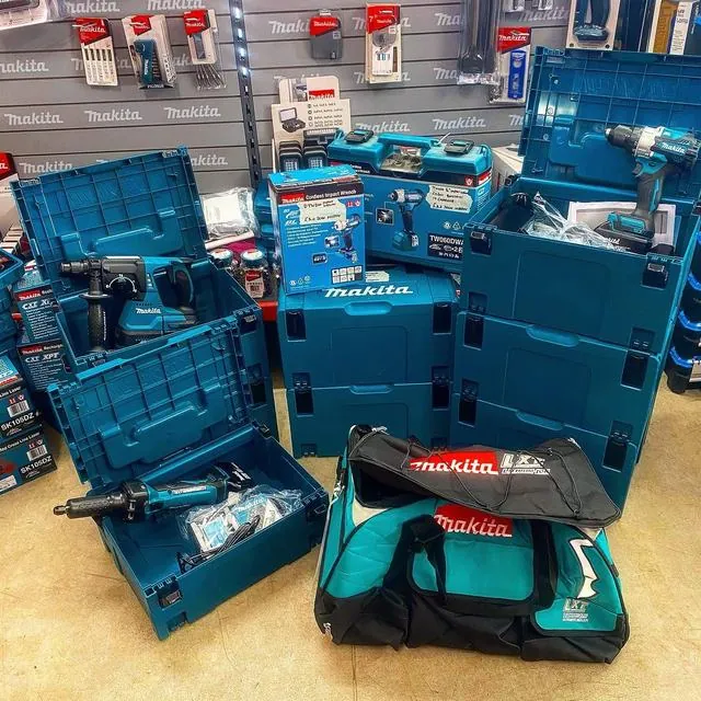Stacked Makita cases, tool bags and cordless kit