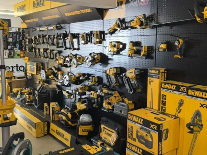 Makita cases and cordless kit stacked on the shop floor